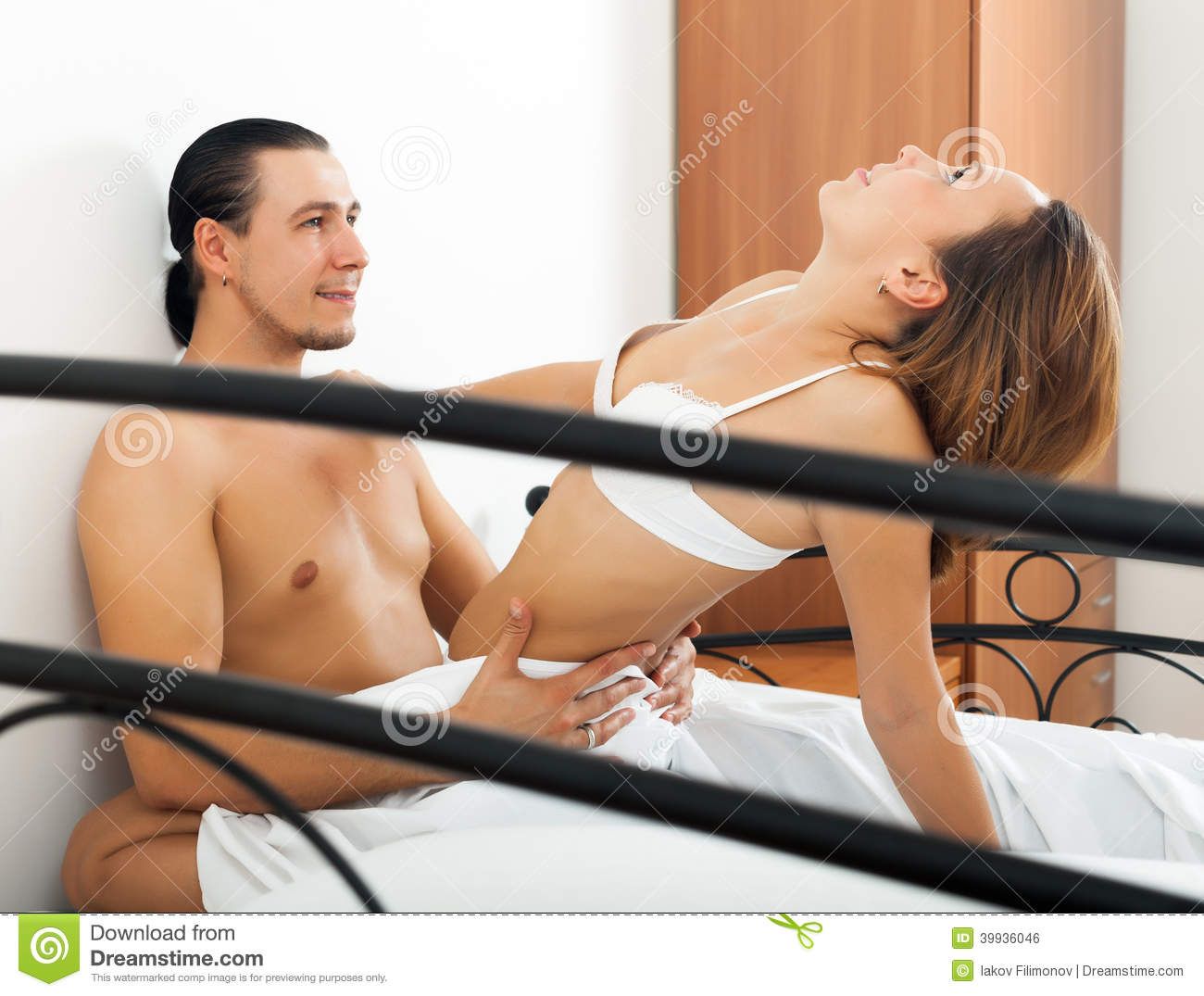 A woman and a man having sex