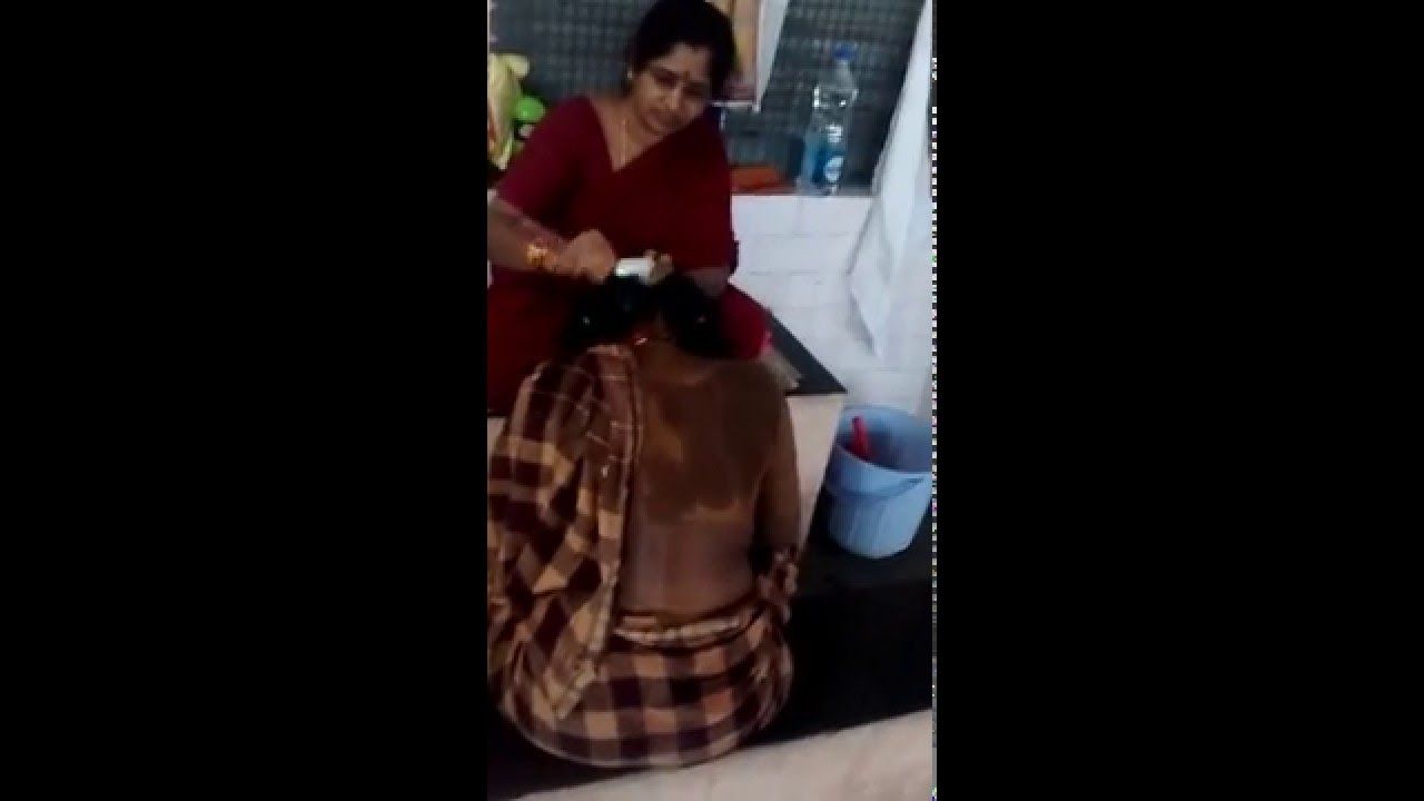 Woman has head shaved by barber